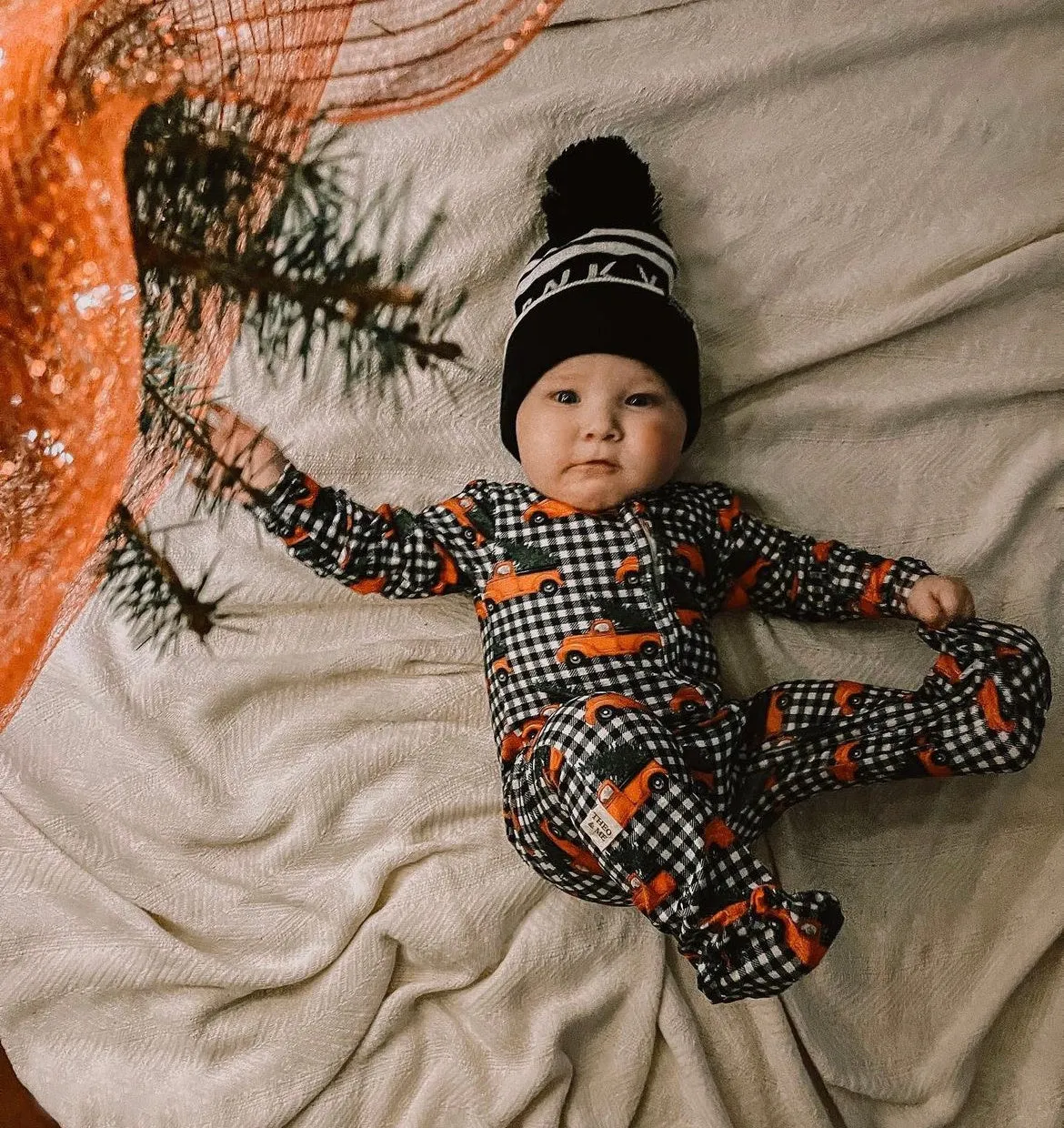 Holiday Baby Zippies Sleepers - Black Checkered With Red Trucks